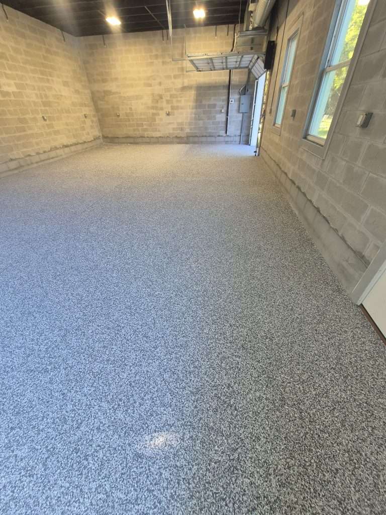 Polyaspartic garage floor coating in Palm Coast FL by First Class Painting & Gator Coating